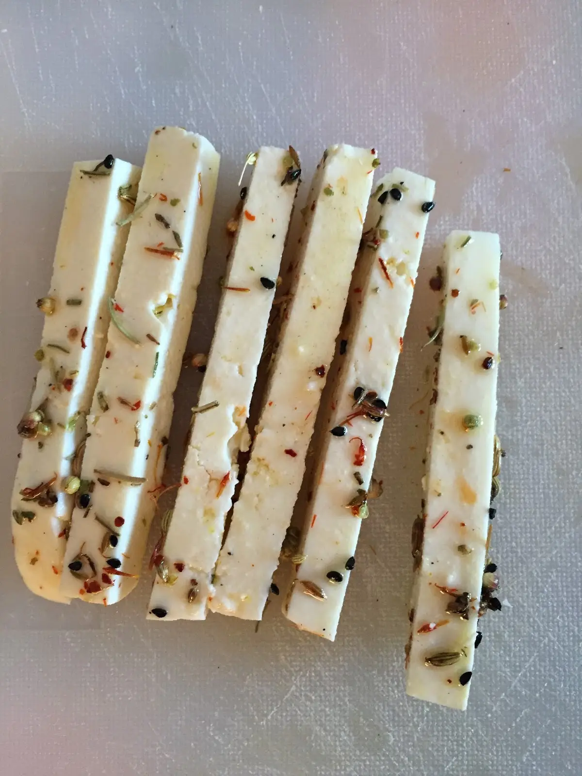 Oven-roasted baby zucchini stuffed with cheese